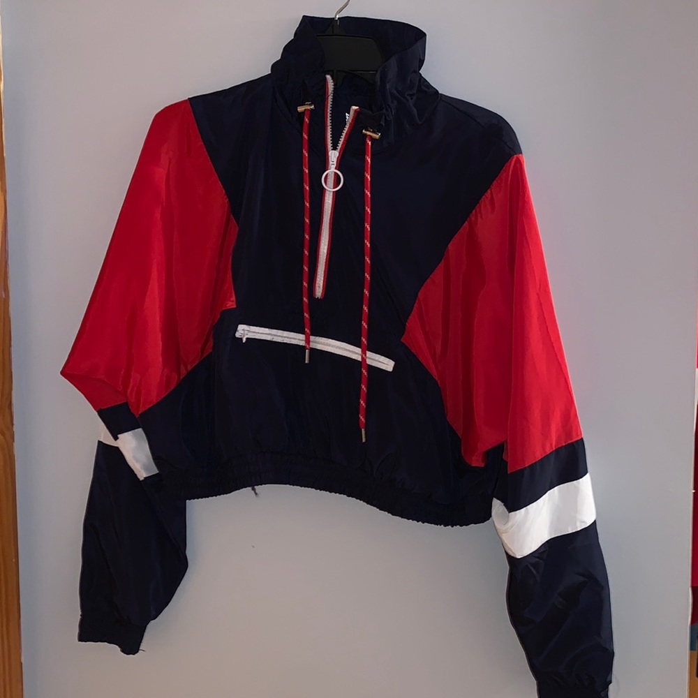 New Look Sport rain jacket. Blue, red and white, has a front zipper pocket.